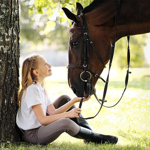 Image of child with horse.