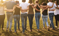 Group of people linked arms