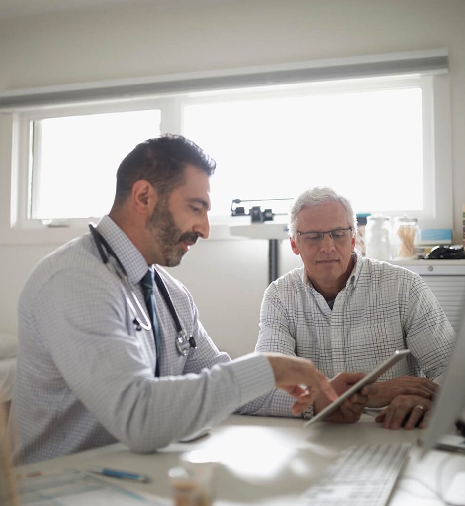 Male doctor with a patient